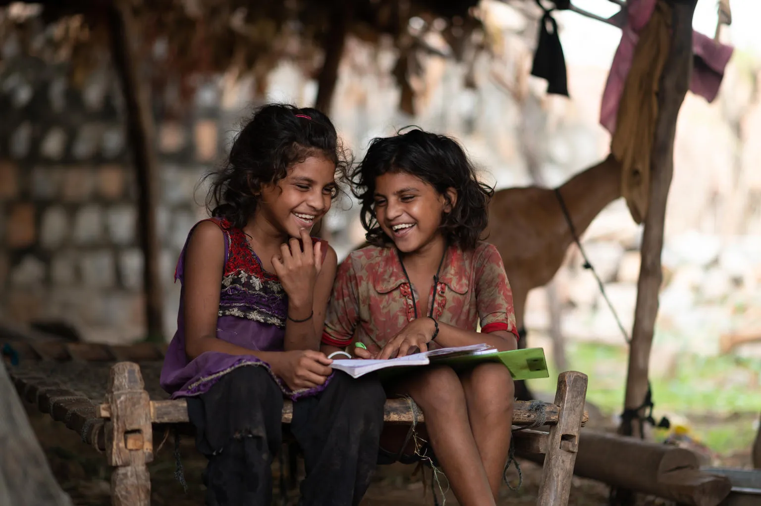 Kanchan (7yrs) and Kashi (7 yr) study at home during the Covid Lockdown . Location : Hindloa Fadia, Limkheda, GujaratLocation : Hindloa Fadia, Limkheda, Gujarat