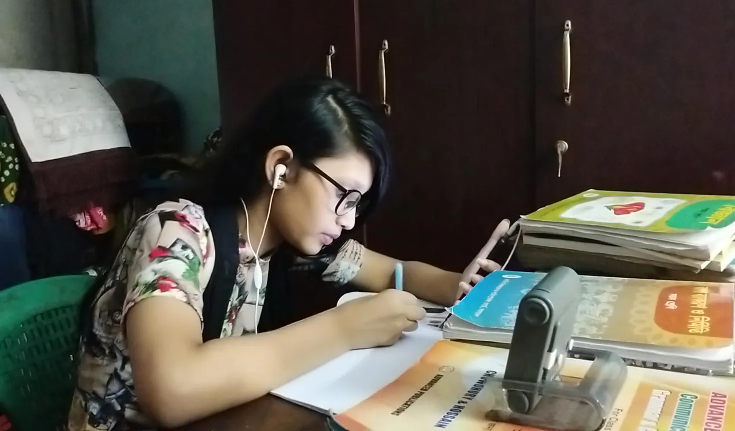 A girl studies at home.