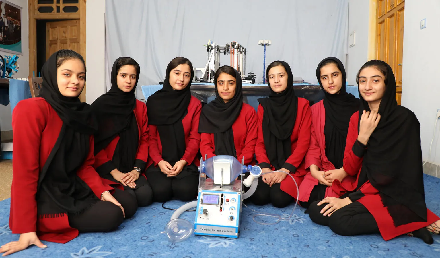 Members of the Afghan Dreamers team with their ventilator prototype.