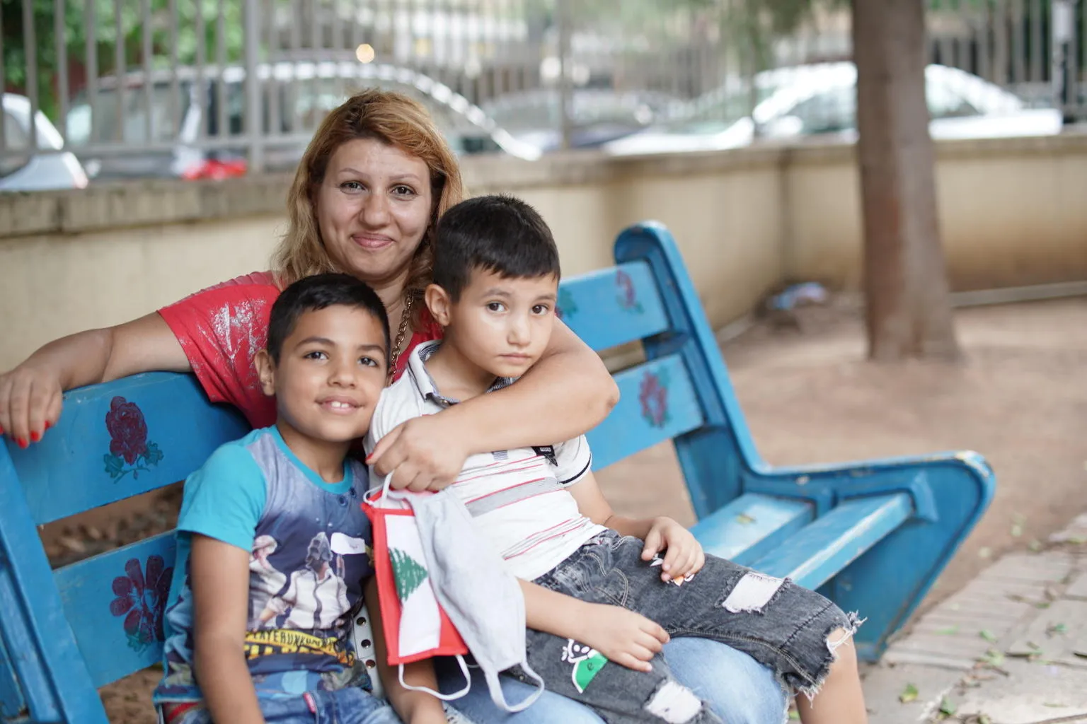 On 1 September 2020, Kevin, 8 years old, left, with his mother Nadida Kayyal Bakli and brother at the UNICEF's children friendly space (CFS) at the Karantina public garden in Beirut, Lebanon.