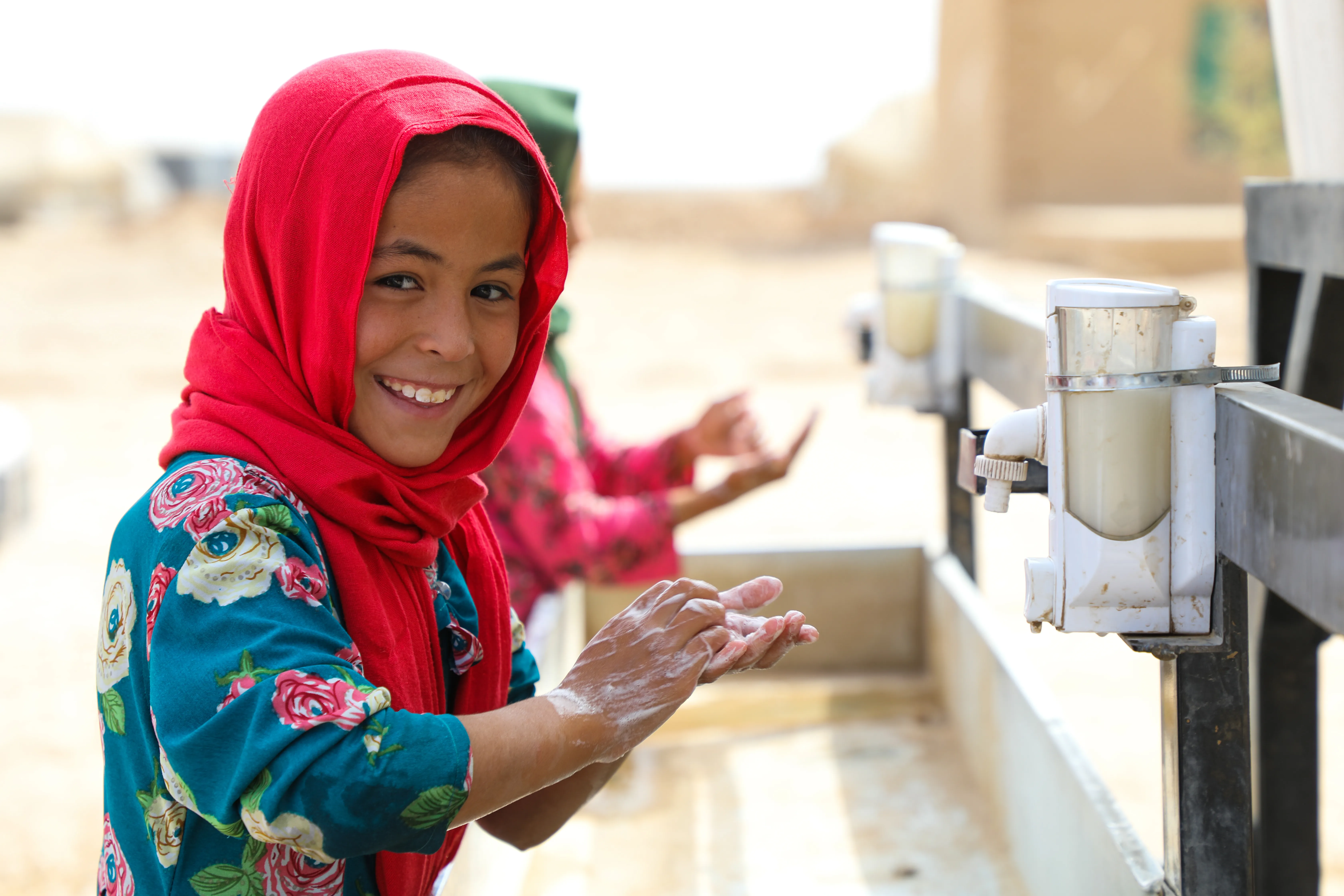 Somaya, 9 is washing her hands at Balkh pronice of Afghanistan. UNICEF Afghanistan provide basic handwashing facilities for Internally displaced children at Ferdousi camp in Nahri Shahi district of Balkh province of Afghansitan.