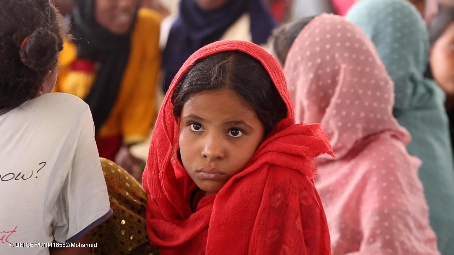 A portrait of a young girl at a Child Friendly Space (CFS) supported by UNICEF in Atbara.