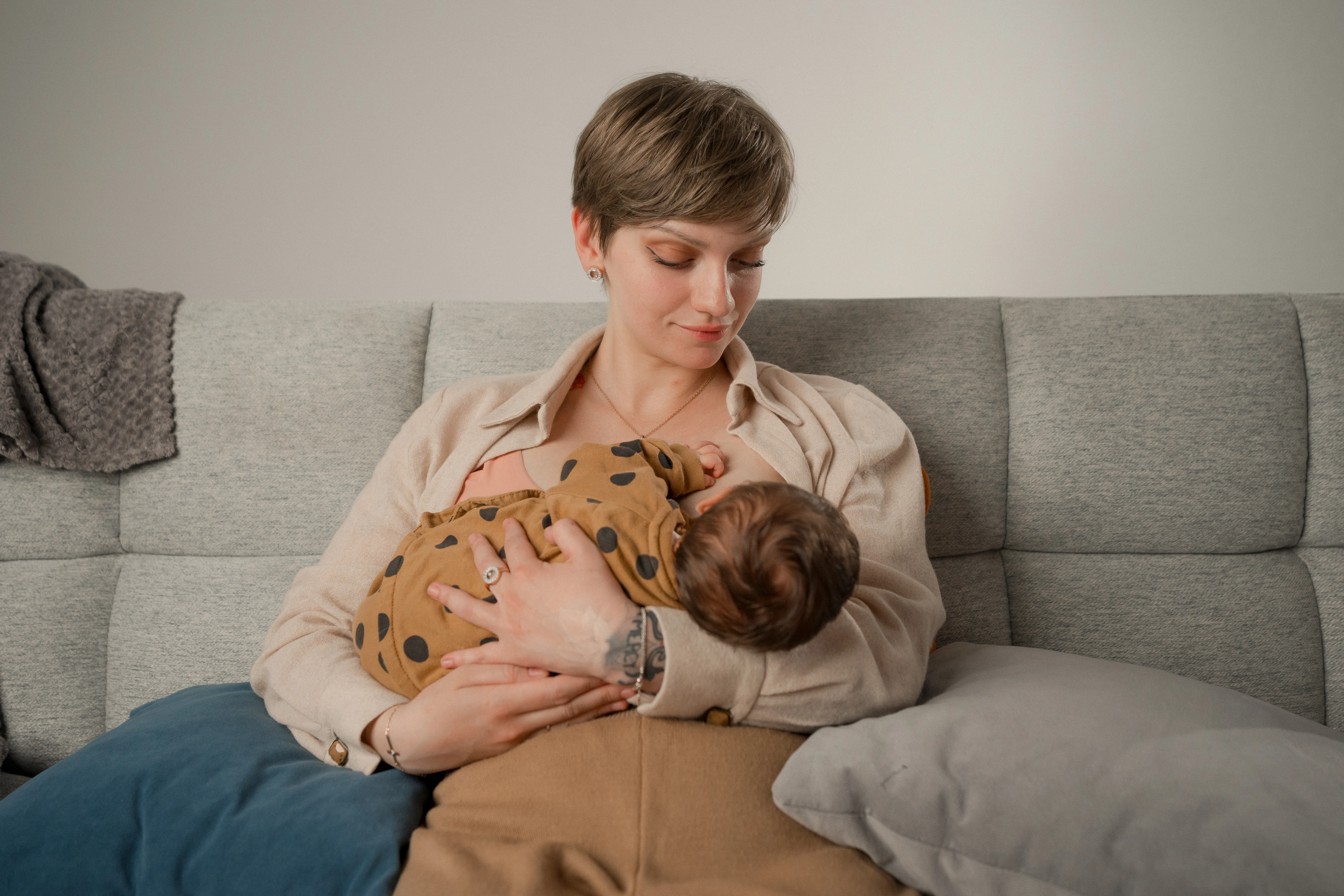 Irina from Moldova is breastfeeding her three-week-old daughter, firmly believing that breastfeeding is the best way to nourish a child during the first months of life.