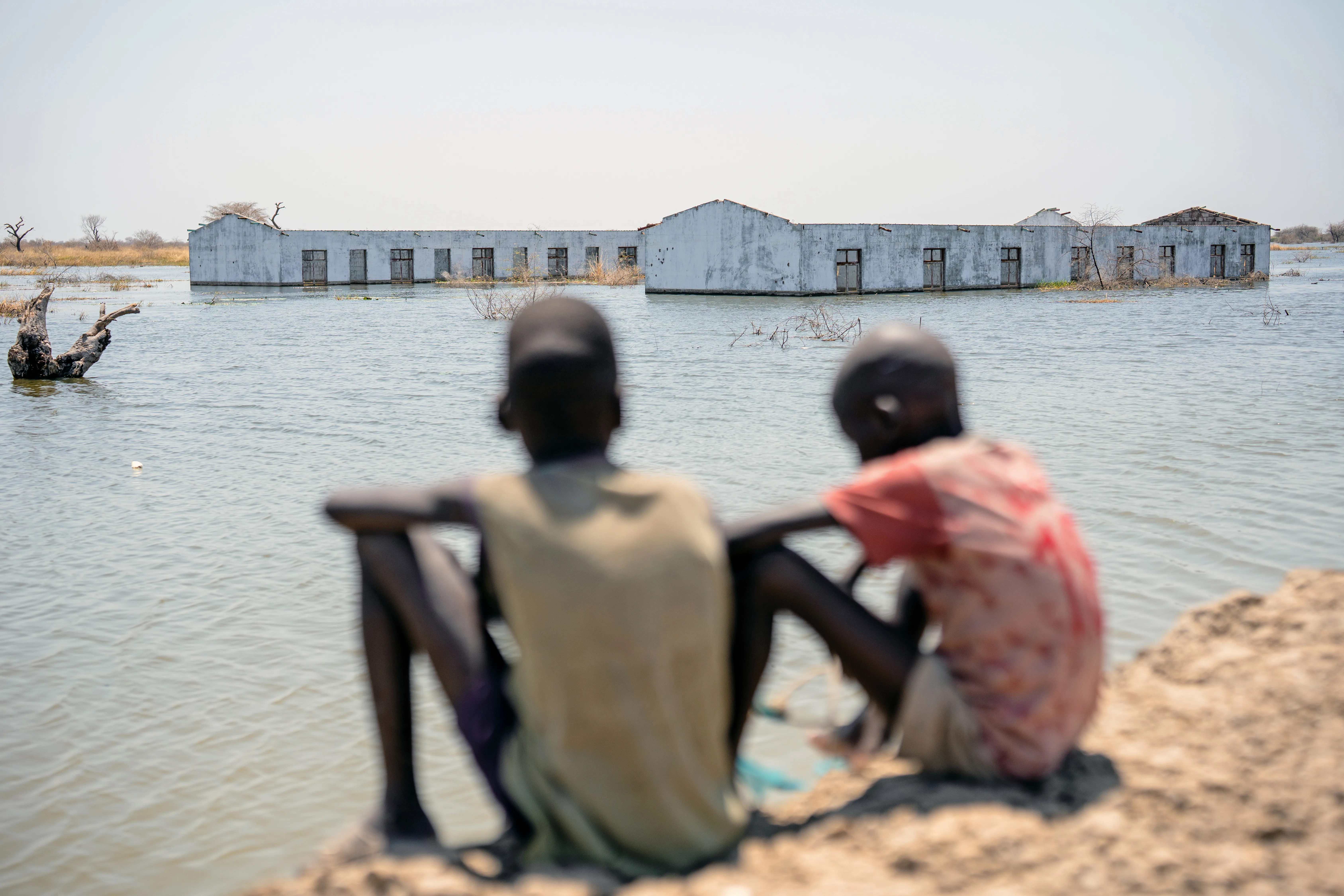 On 4th March 2023, boys look out over their flooded school in Bentiu, Unity State, South Sudan.