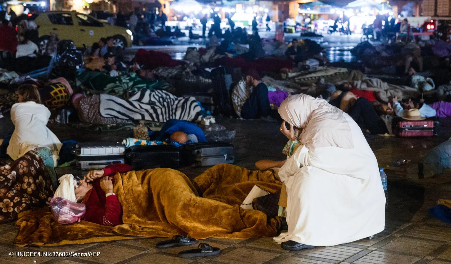 Residents stay out at a square in Marrakesh on September 9, 2023, after an earthquake.