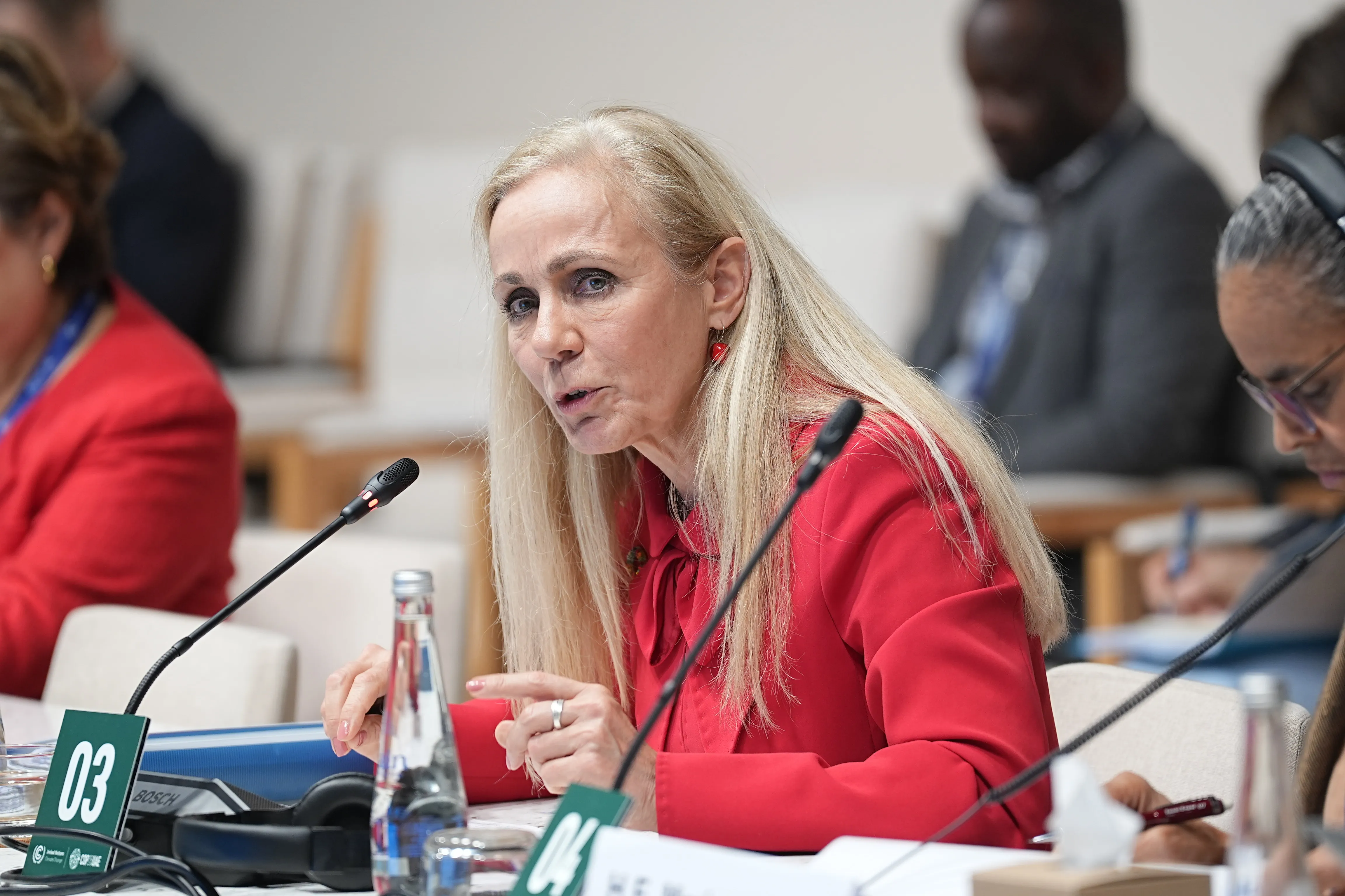 Kitty van der Heijden speaking at an event. 