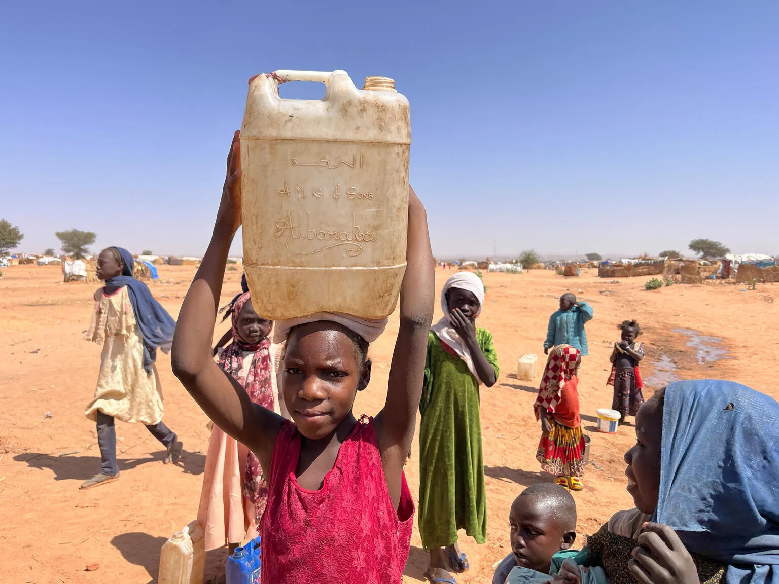 On 3 February 2024, children collect water at a UNICEF borehole inside Adré refugee settlement in Chad.