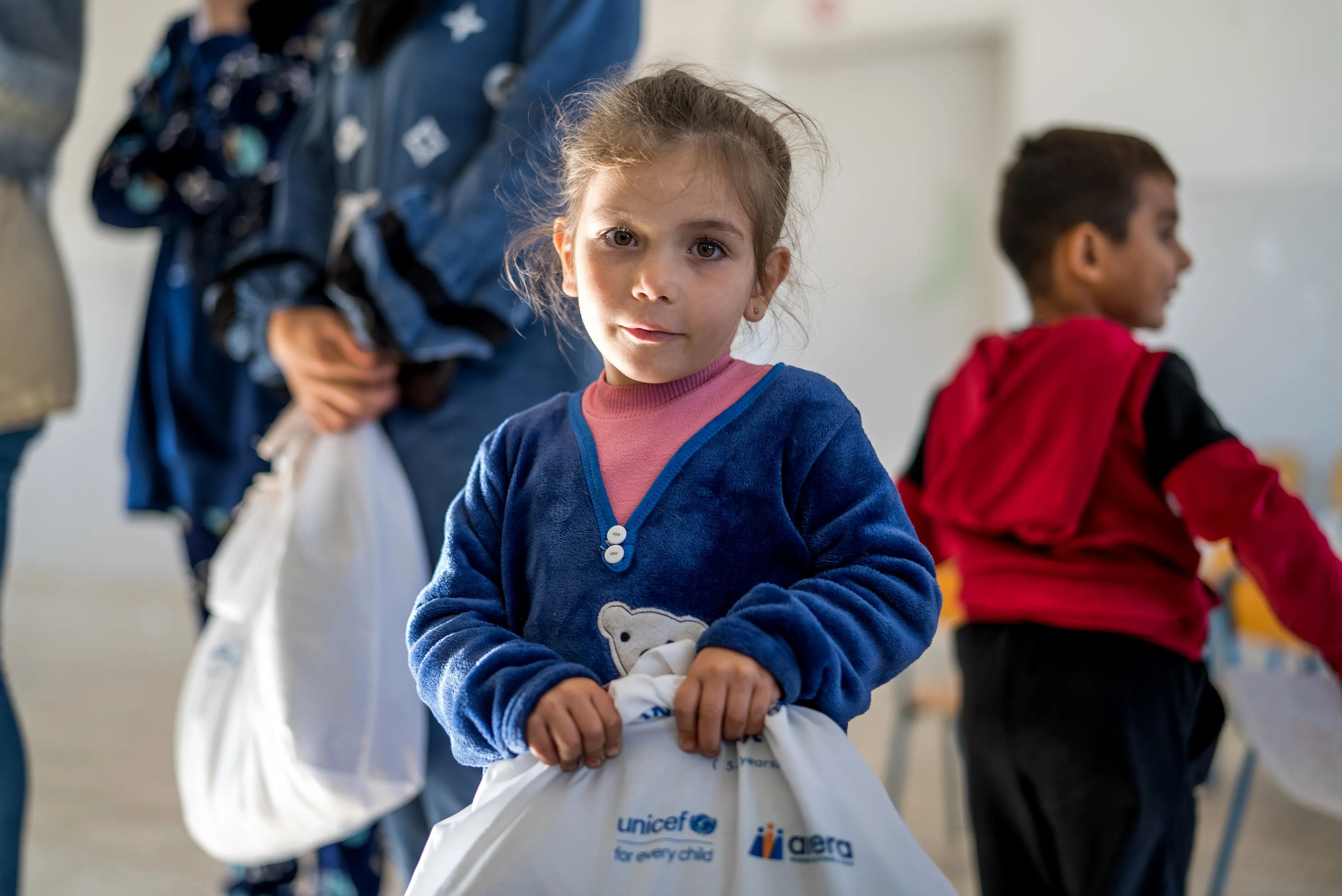 Aya, 4 years old. UNICEF is distributing winter clothes and school kits to displaced families in South Lebanon.