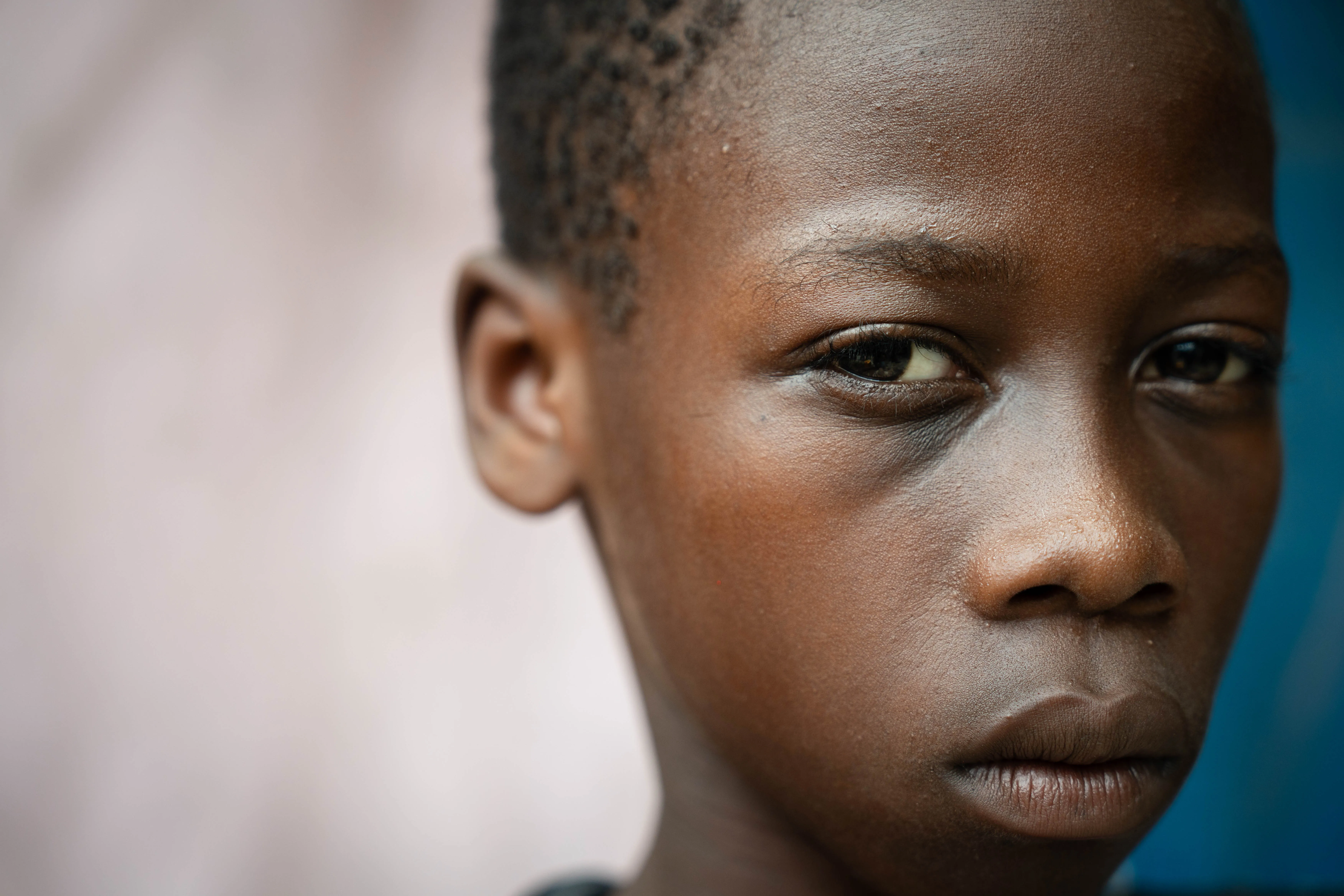 A child in Haiti looks towards the camera 