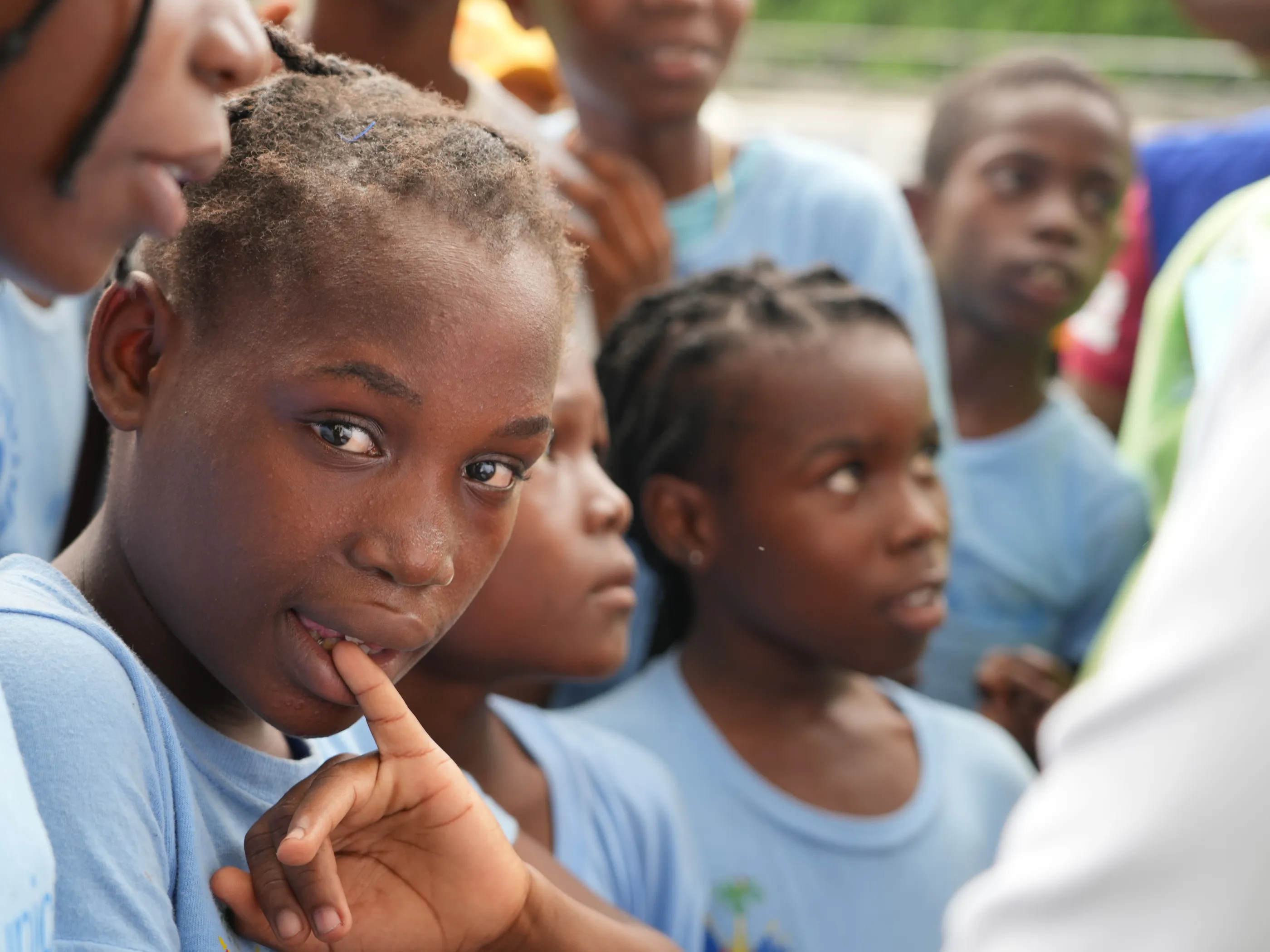 A child in Haiti looks towards the camera. 