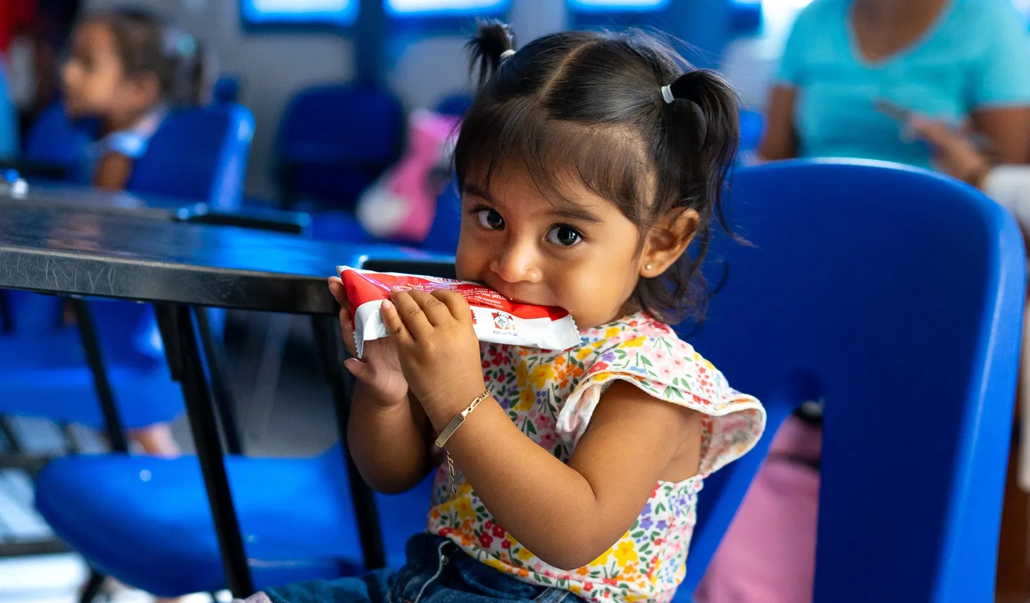 A girl eating Plumpy'Nut