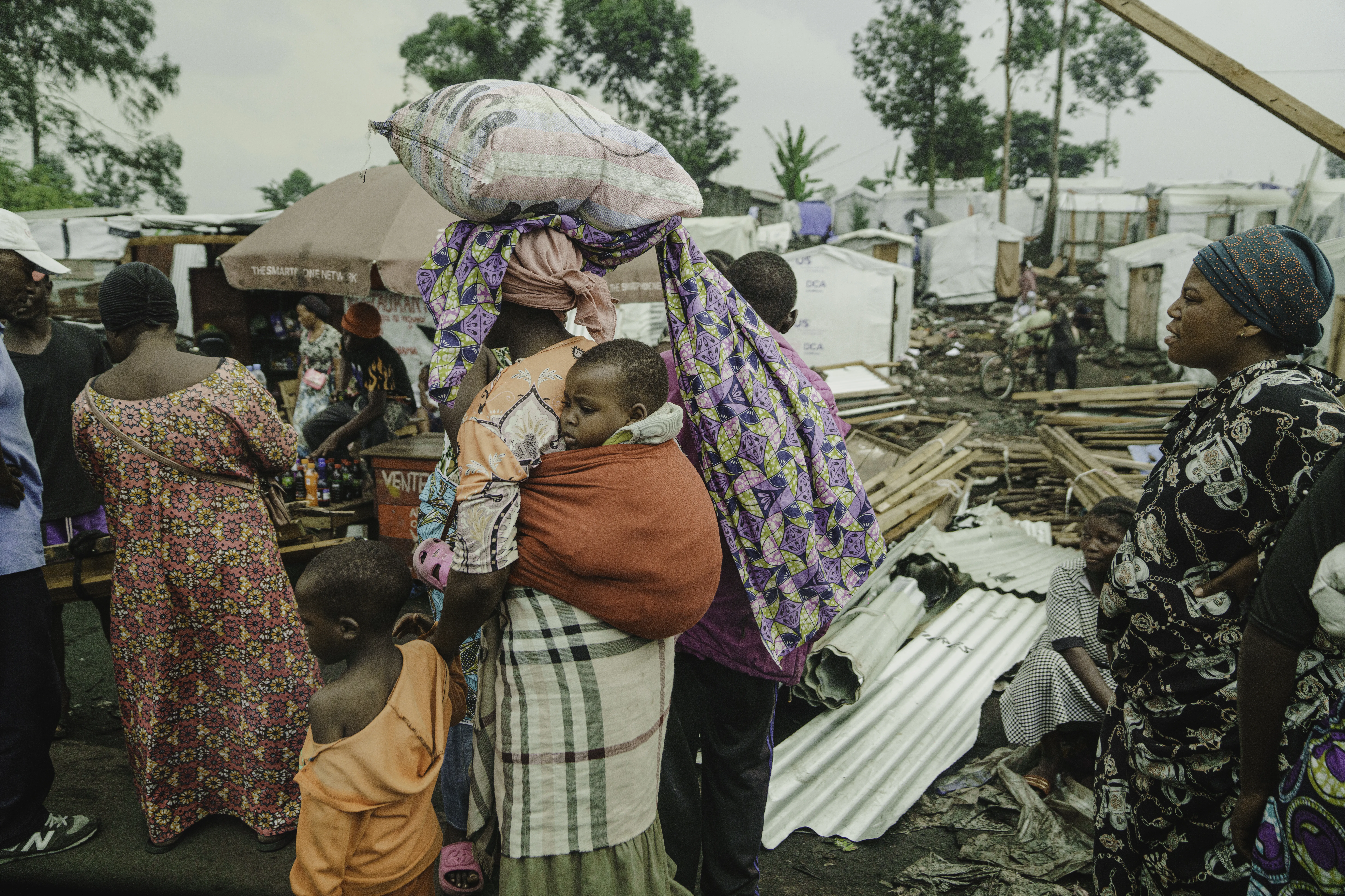 Families who had been living in displaced persons camps around Goma seek shelter on their way to Shasha village in North Kivu province, DR Congo