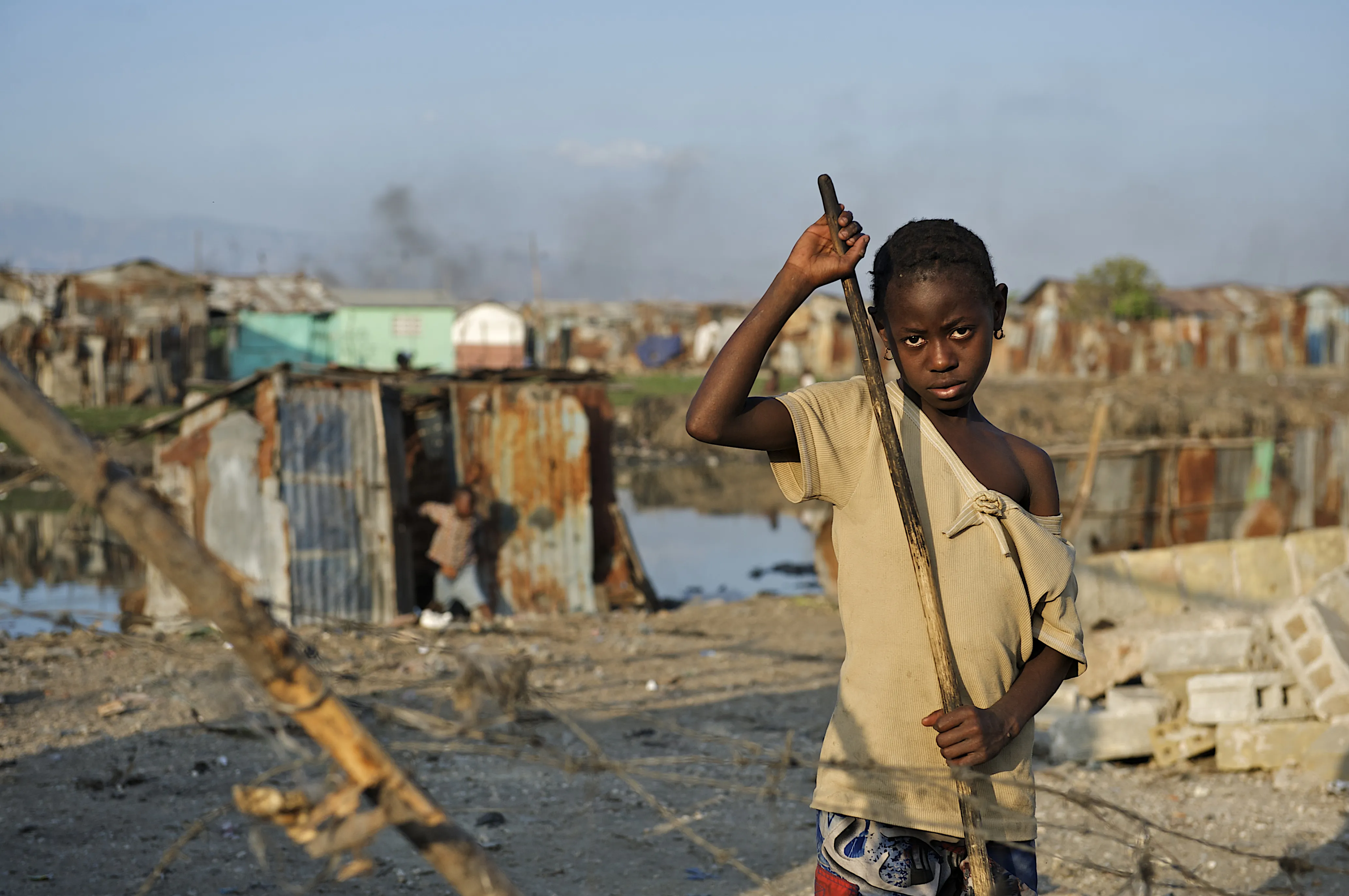 On 6 February, Luisnez, 10, sweeps away garbage and debris in front of her destroyed home, in Cité Soleil, one of the poorest neighbourhoods in Port-au-Prince, the capital. Together with three younger siblings and her mother, Luisnez is among many who sleep outdoors, or in makeshift tents, because their homes were damaged or destroyed during the earthquake or because they fear additional aftershocks “I don’t know what happened,” she said. “I was playing outside and everything started to fall."