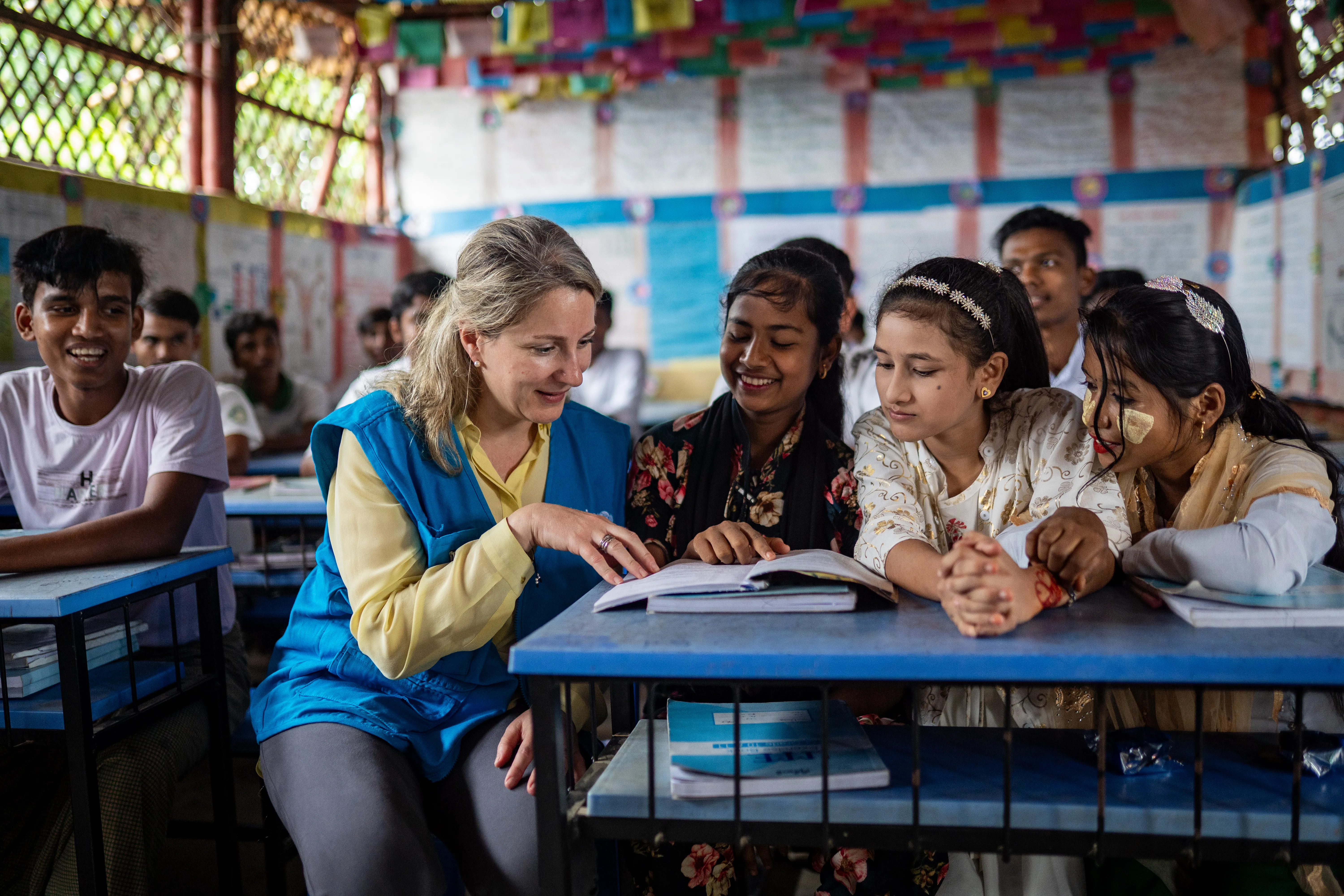 On 8 October 2025, at the Rohingya Refugee Camp in Cox’s Bazar, Bangladesh, UNICEF Private Fundraising and Partnerships Division Director, Carla Haddad Mardini, talks with young students during a visit to the Learning Centre..