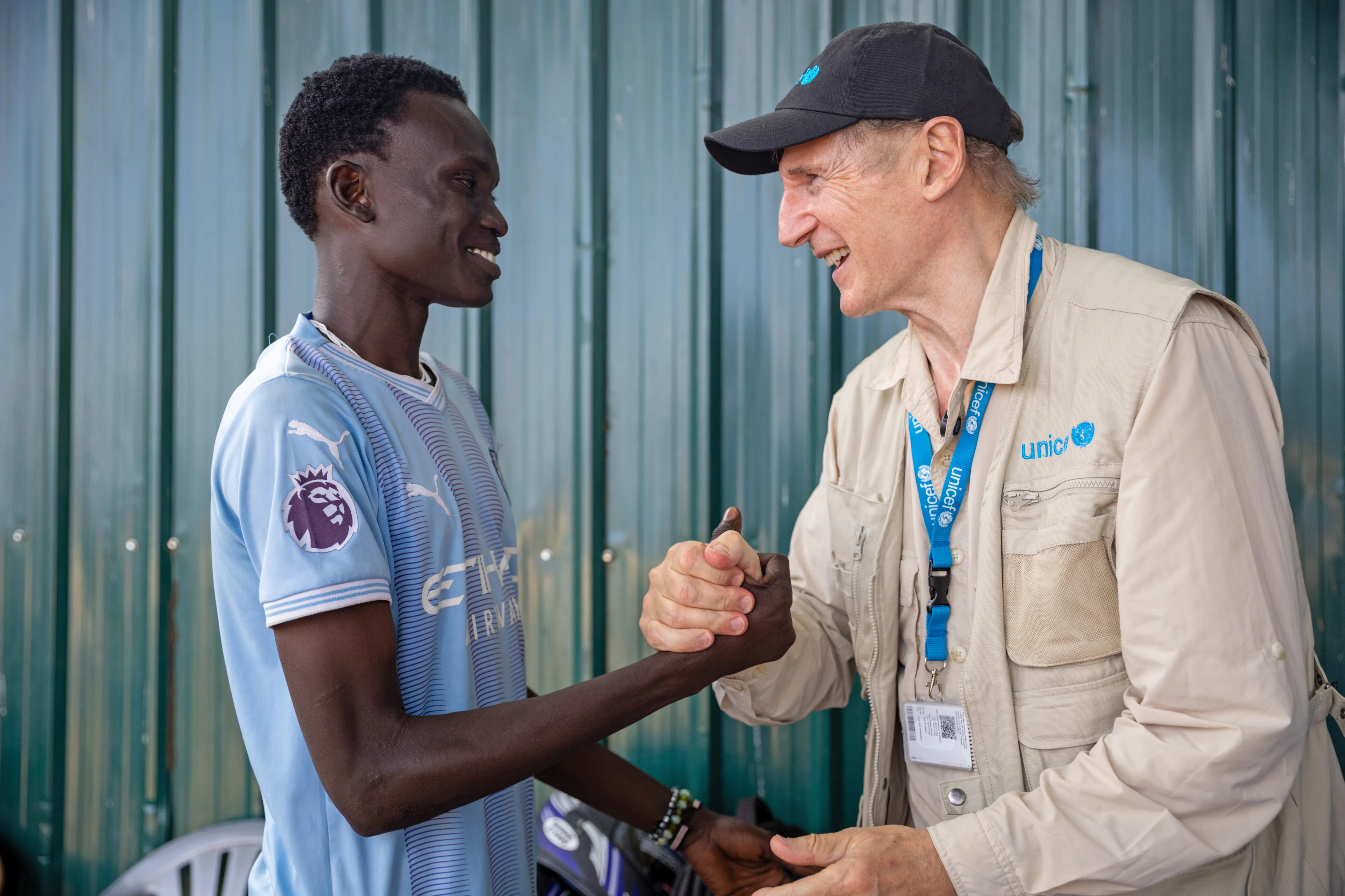 UNICEF Goodwill Ambassador Liam Neeson meets 20-year-old Alan at the Gredo Youth Centre in Juba, South Sudan.