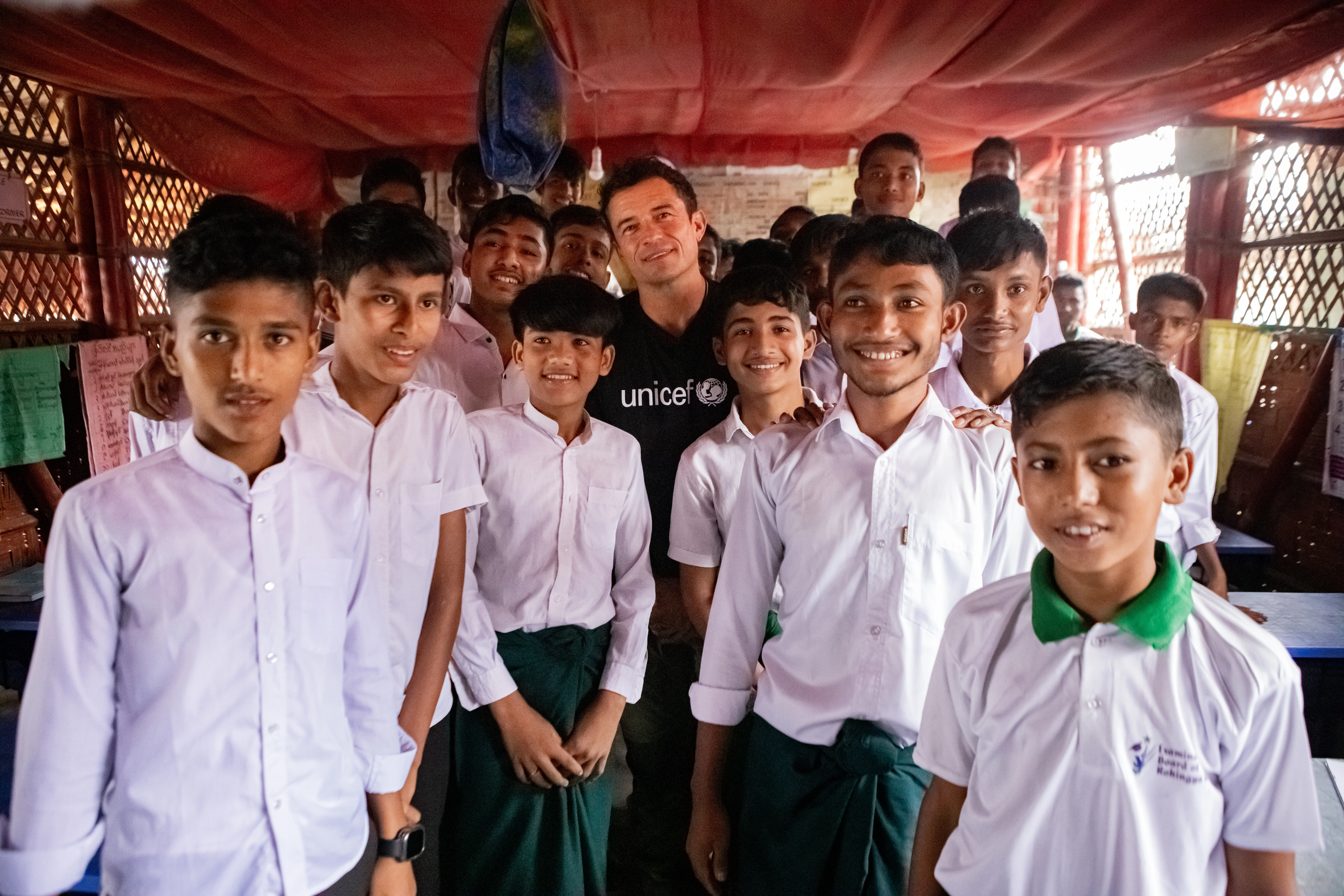 UNICEF Goodwill Ambassador Orlando Bloom pictured with Grade 9 children in Cox's Bazar who are at risk of losing access to education due to global funding cuts.