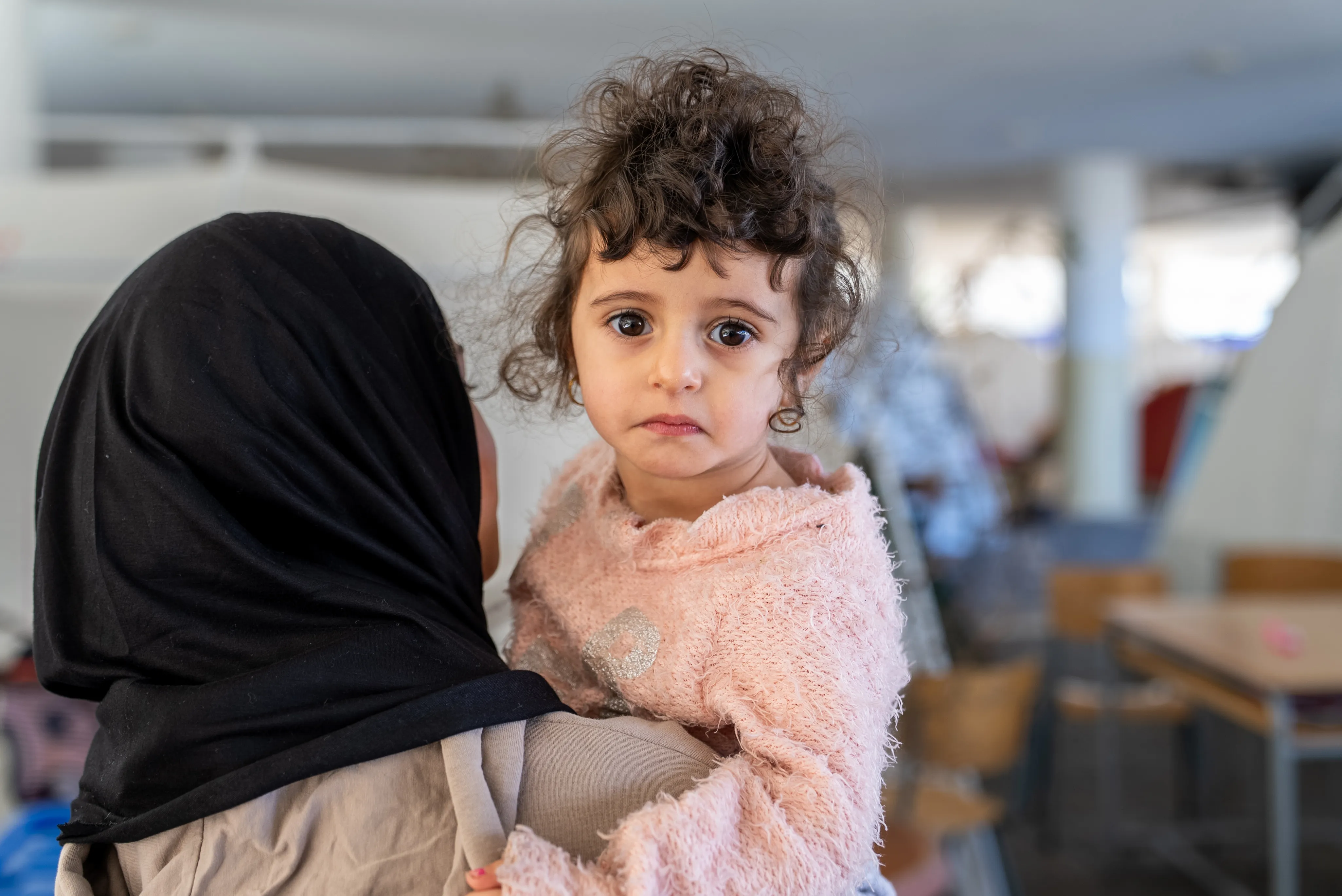 Mother holds her child in Lebanon