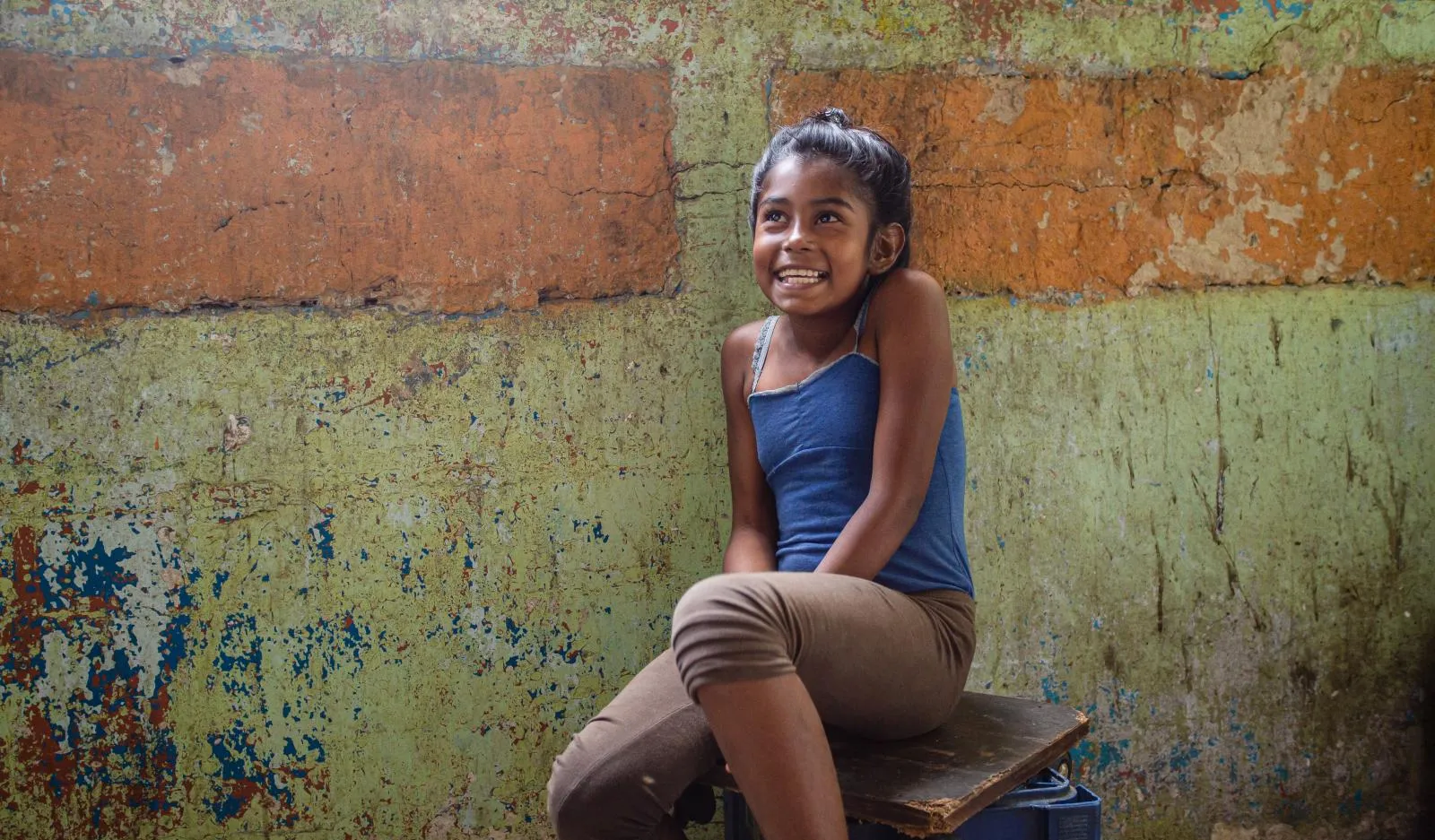 Duglianis sits inside her home in Petare, Venezuela.