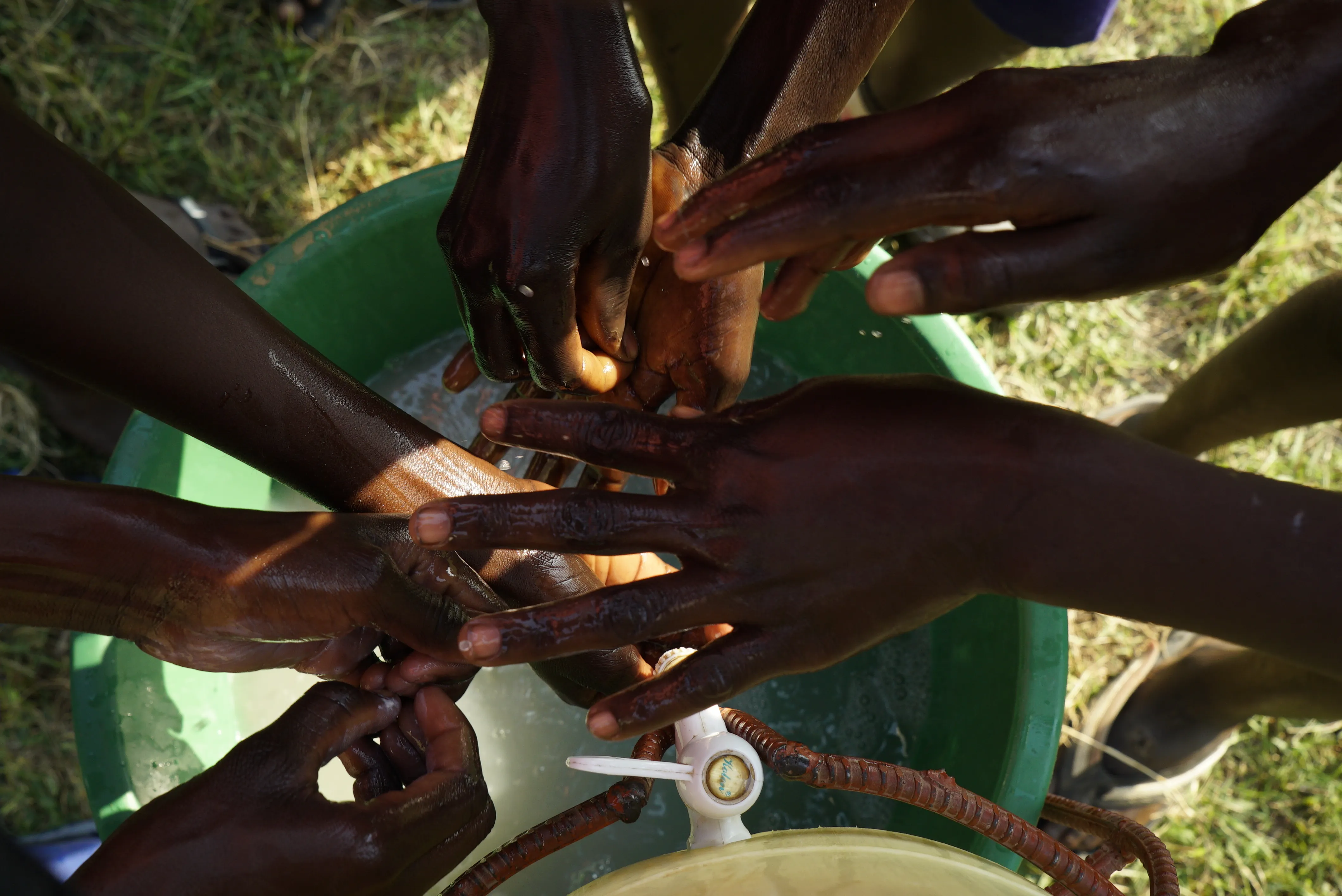 Children wash their hands at a school WASH club
