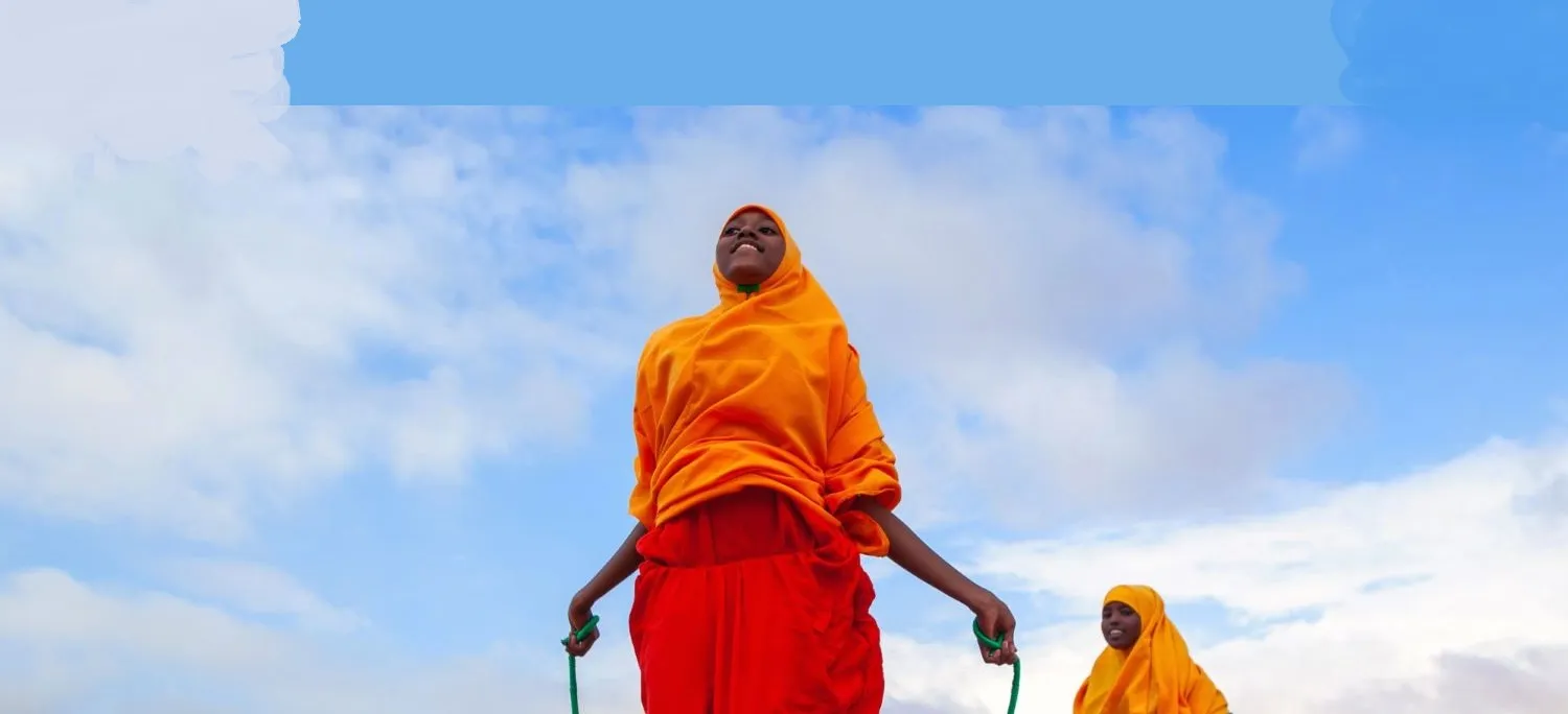 Two girls jump rope at a UNICEF-supported school in Dollow, Somalia.