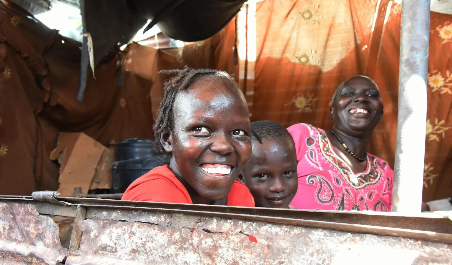 Khamisa smiles with her two youngest children