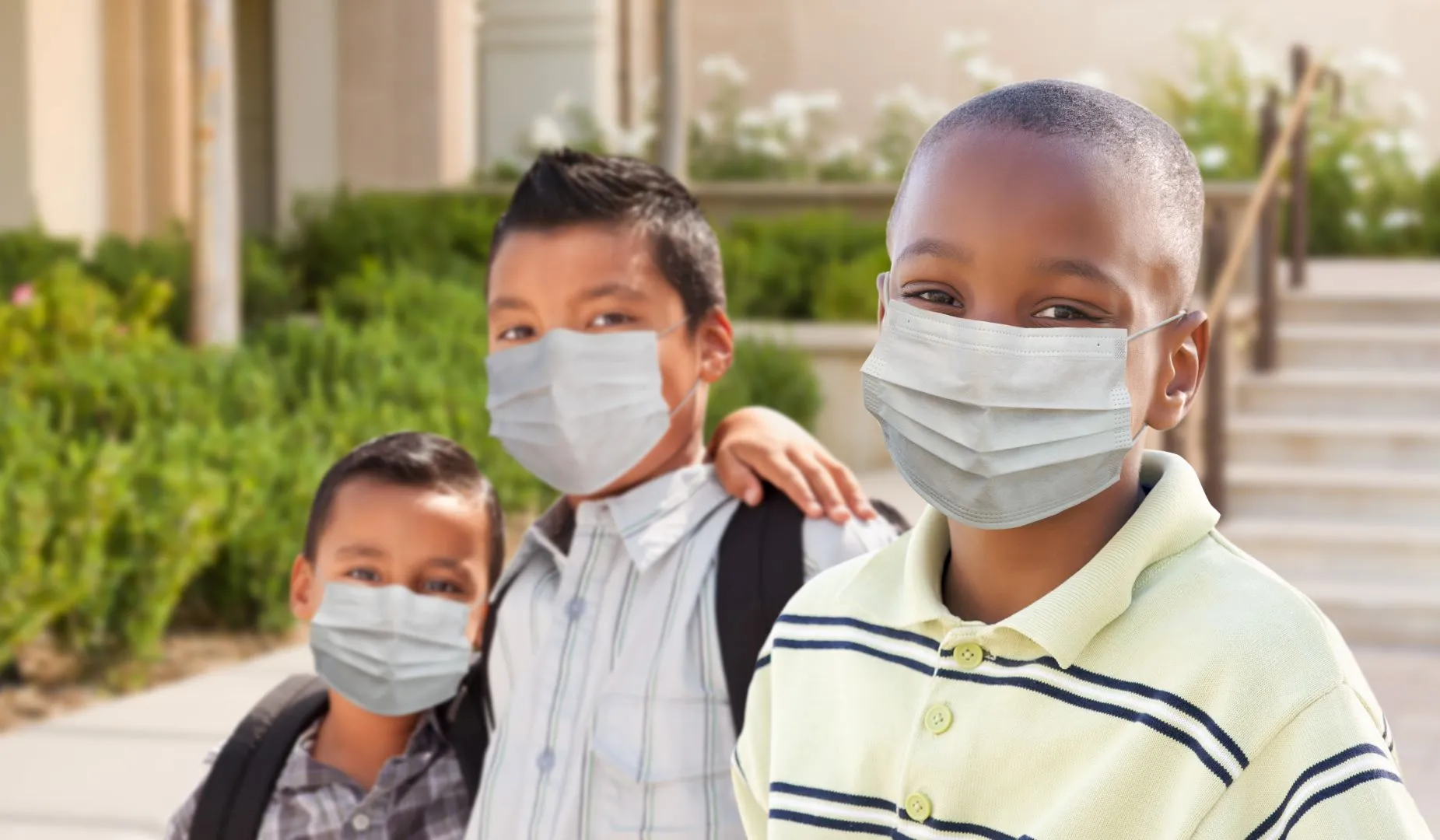 Group of 3 young boys masked