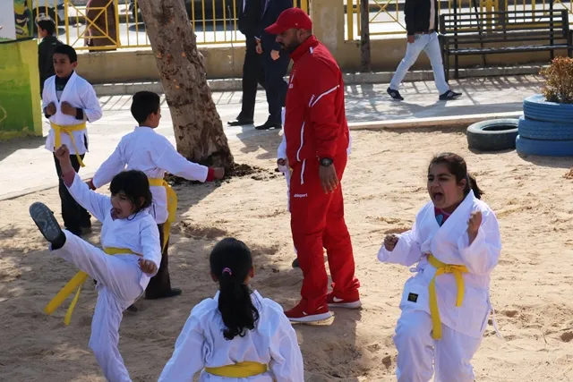 Children learning karate