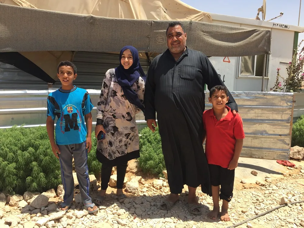 Abu Kareem with three of his four children.