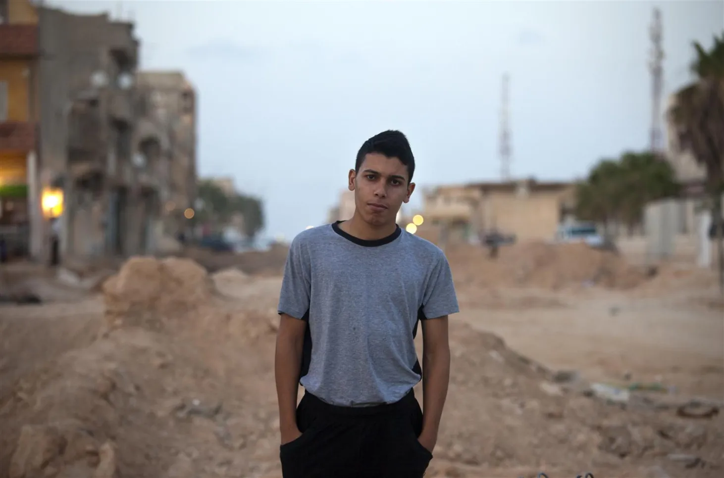 Sidiq stands on a street in Benghazi, Libya.