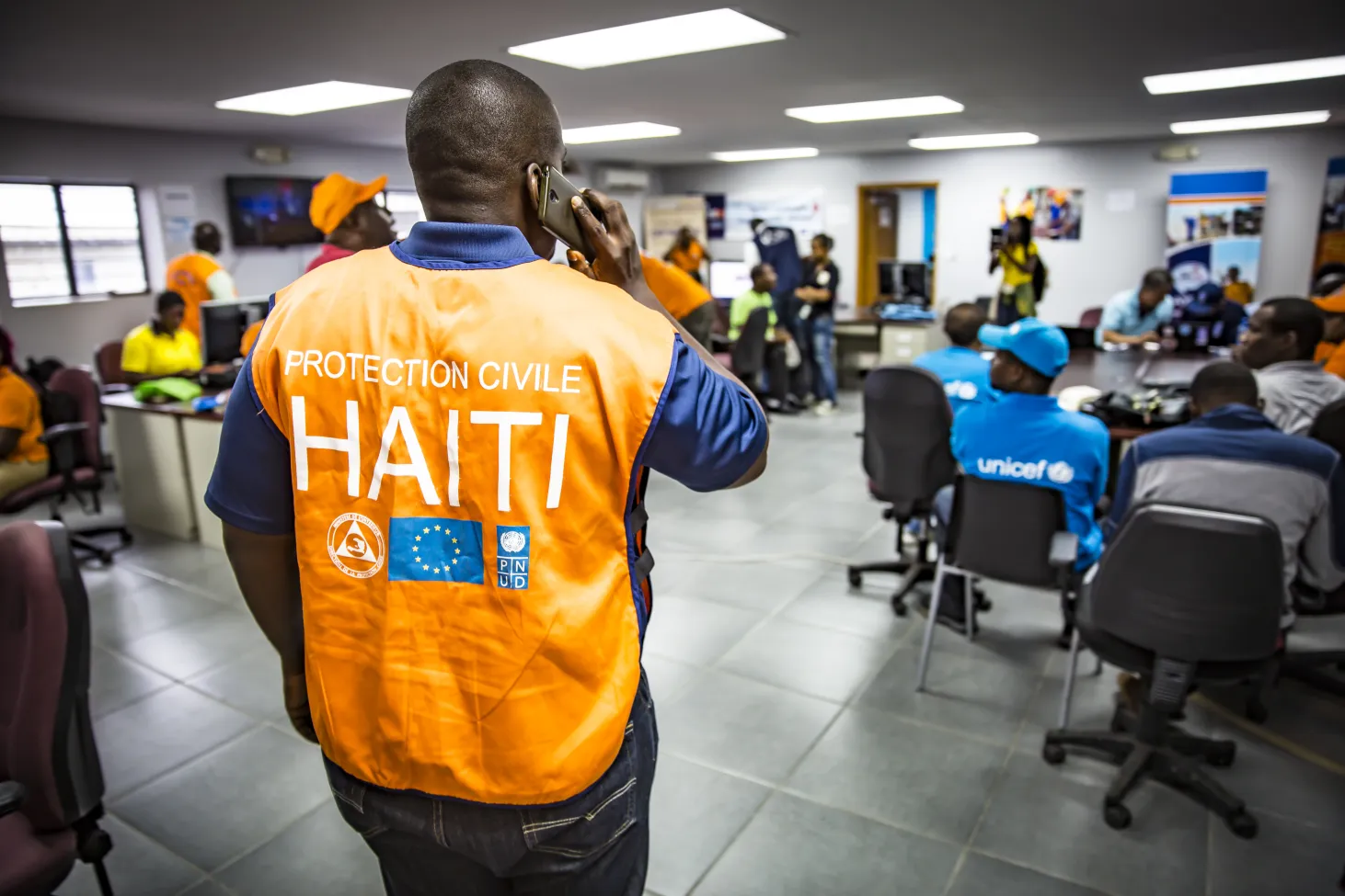 a UNICEF staffer answers a phone call
