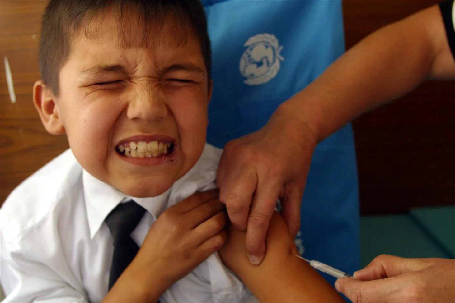 Ten-year-old Mehrdod receives a measles vaccine in Dushanbe.