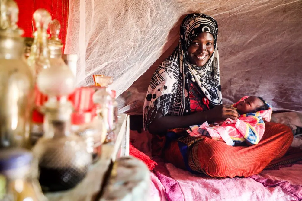Fouda Ali, 25, holds her newborn daughter