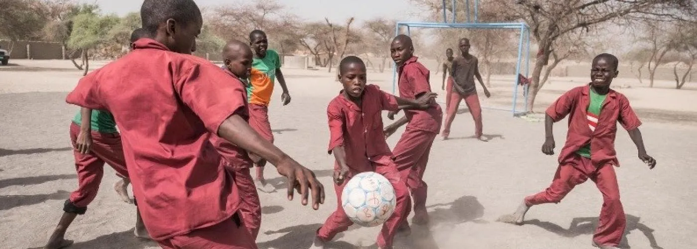 Students playing football at the School of Peace, Kousseri, internally displaced site, in Lake Region, Chad.
