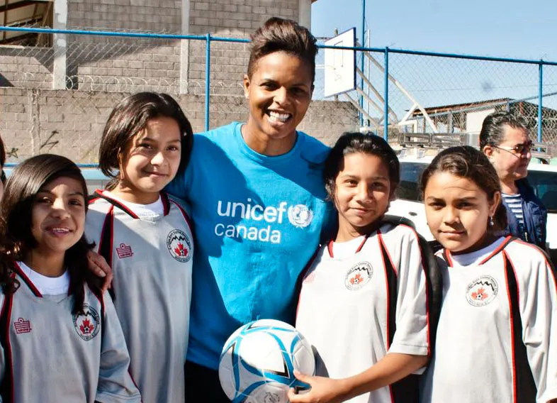 Karina Leblanc with child soccer players