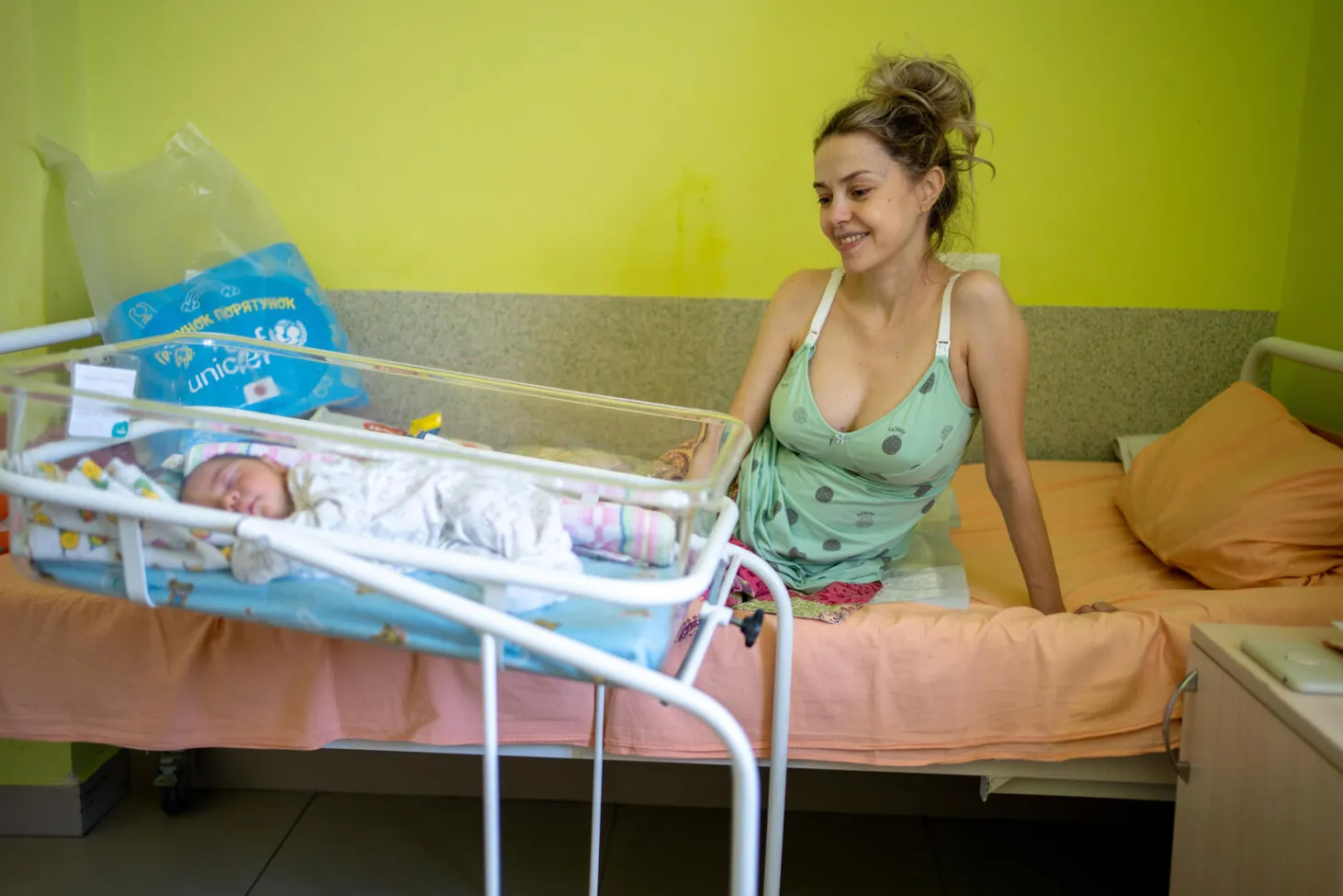 Halyna with her little newborn Danylo in a hospital ward in Lviv, Ukraine.