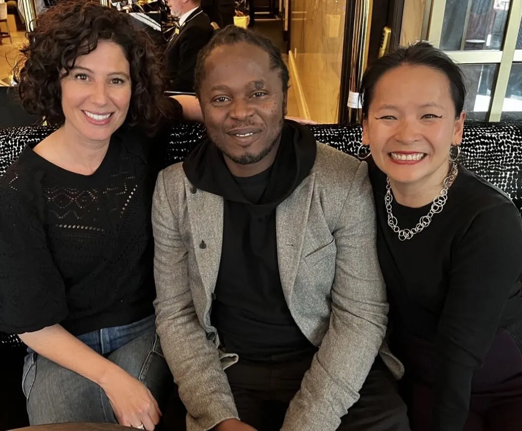 Three people, Sevaun Palvetzian, CEO & President UNICEF Canada; Ishmael Beah, Author and UNICEF Goodwill Ambassador; Daisy Cobden, UNICEF Water For Life Gala Volunteer, looking into camera 