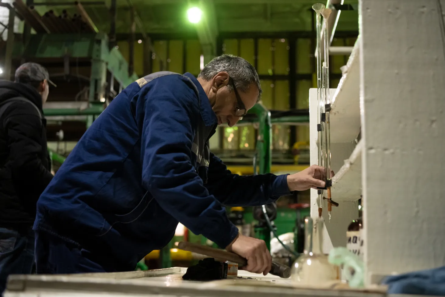 A worker at the city’s water utility performs maintenance on equipment. For years, the utility relied on outdated and worn-out infrastructure, complicating efforts to provide stable water services. 