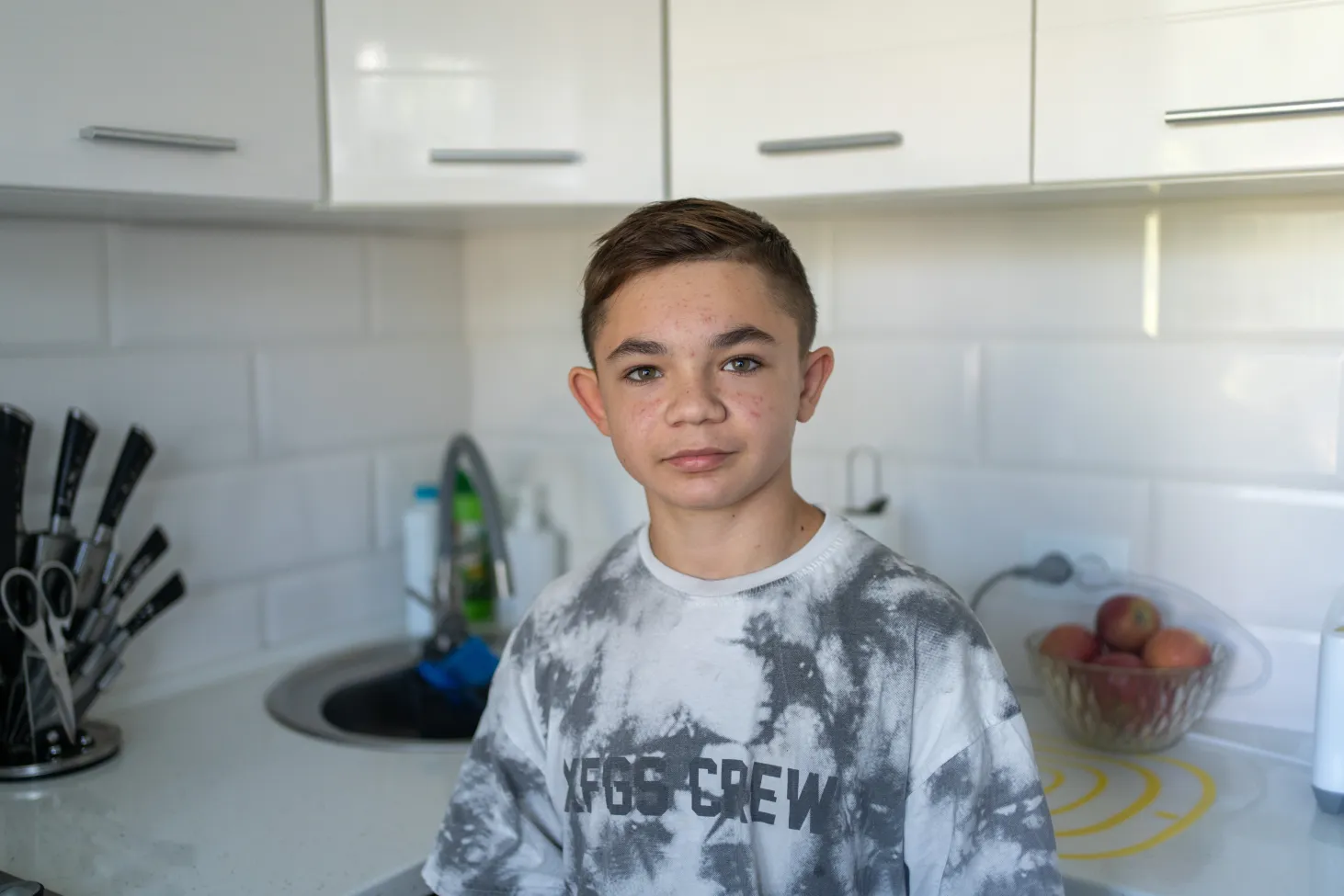 13-year-old Bohdan at his kitchen.