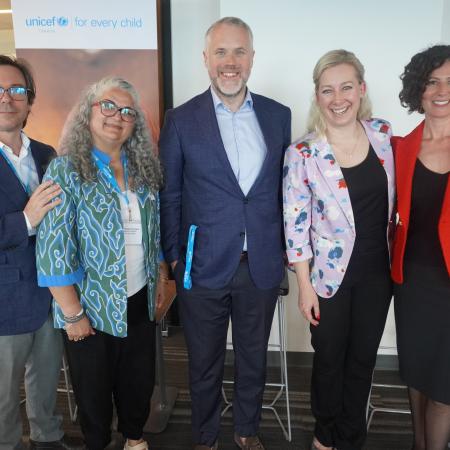 Group photo of the panel participants during the event. 