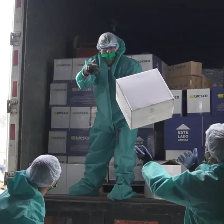 Workers unload medical supplies in Ecuador.