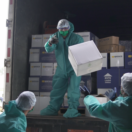 Workers unload medical supplies in Ecuador.