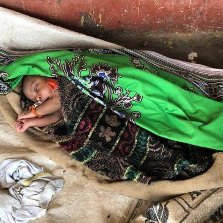 Baby Teresa sleeps on a makeshift mat.