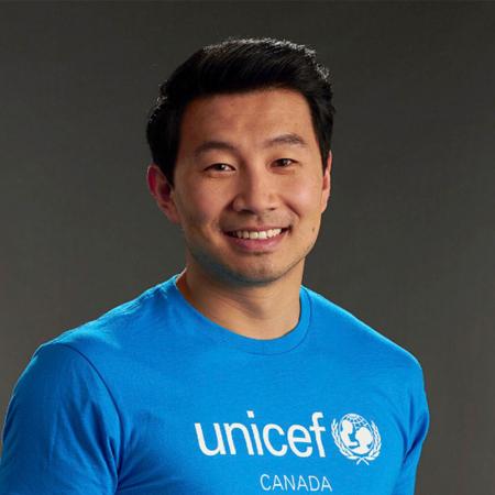 Simu Liu in a cyan UNICEF Canada T-Shirt