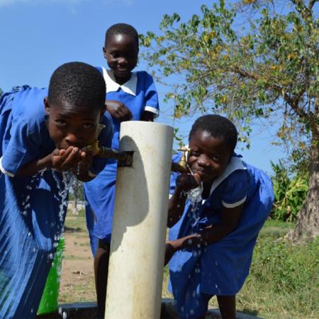 Girls drinking water in Malawi