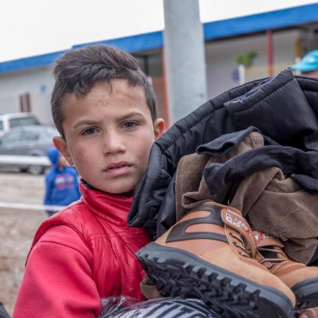 boy receives winter clothes