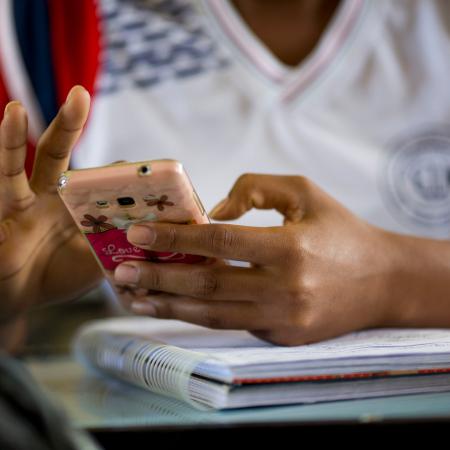 A student uses a mobile phone.