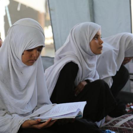 A 9-year old girl in class at a ‘tented school’ on the outskirts of Jalalabad town, eastern Afghanistan.