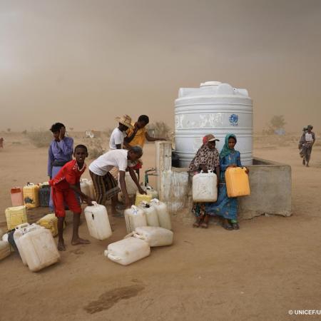 Children collect water in Hajjah Yemen