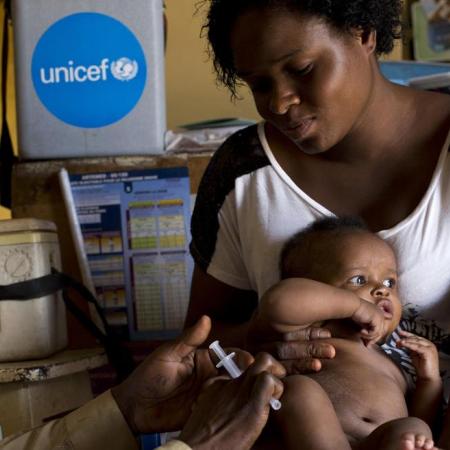 baby receives vaccination in DRC