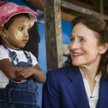 UNICEF Executive Director Henrietta Fore sits with a child during visit to Myanmar